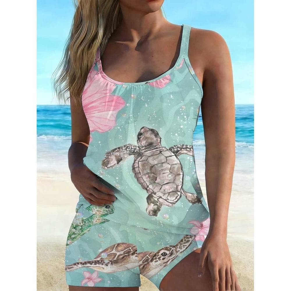 This Is a Loose-Fitting Tankini Swimsuit Set for Women in a Light Blue Color, Featuring a Floral Sea Turtle Design. It Includes a U-Neck Camisole Top And High-Waisted Boyshort Bottoms