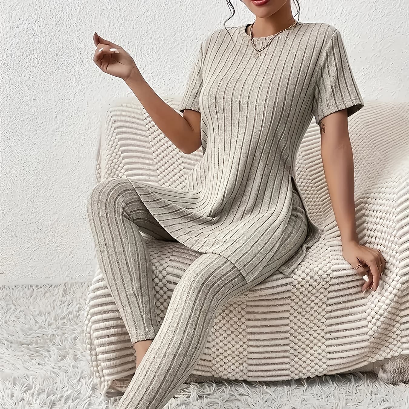 This Is a Comfortable Loungewear Set Suitable for Spring And Autumn, Featuring a Stylish Short-Sleeve Round-Neck Top with Slits And High-Waisted Skinny Pants